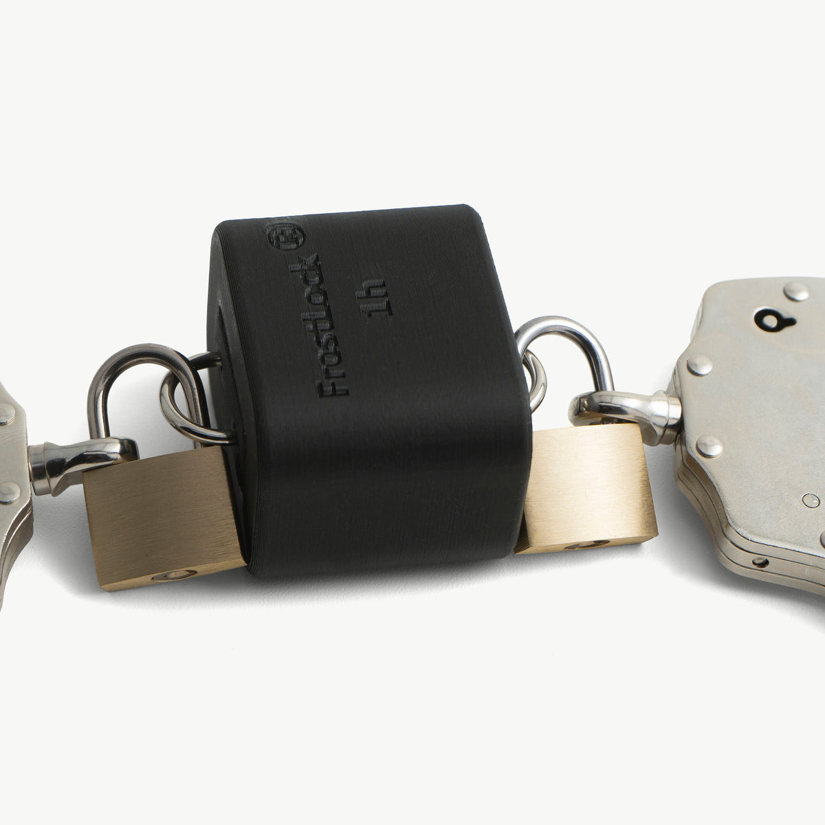 Close-up of the black FrostLock ice lock with brass padlocks attached to the handcuffs