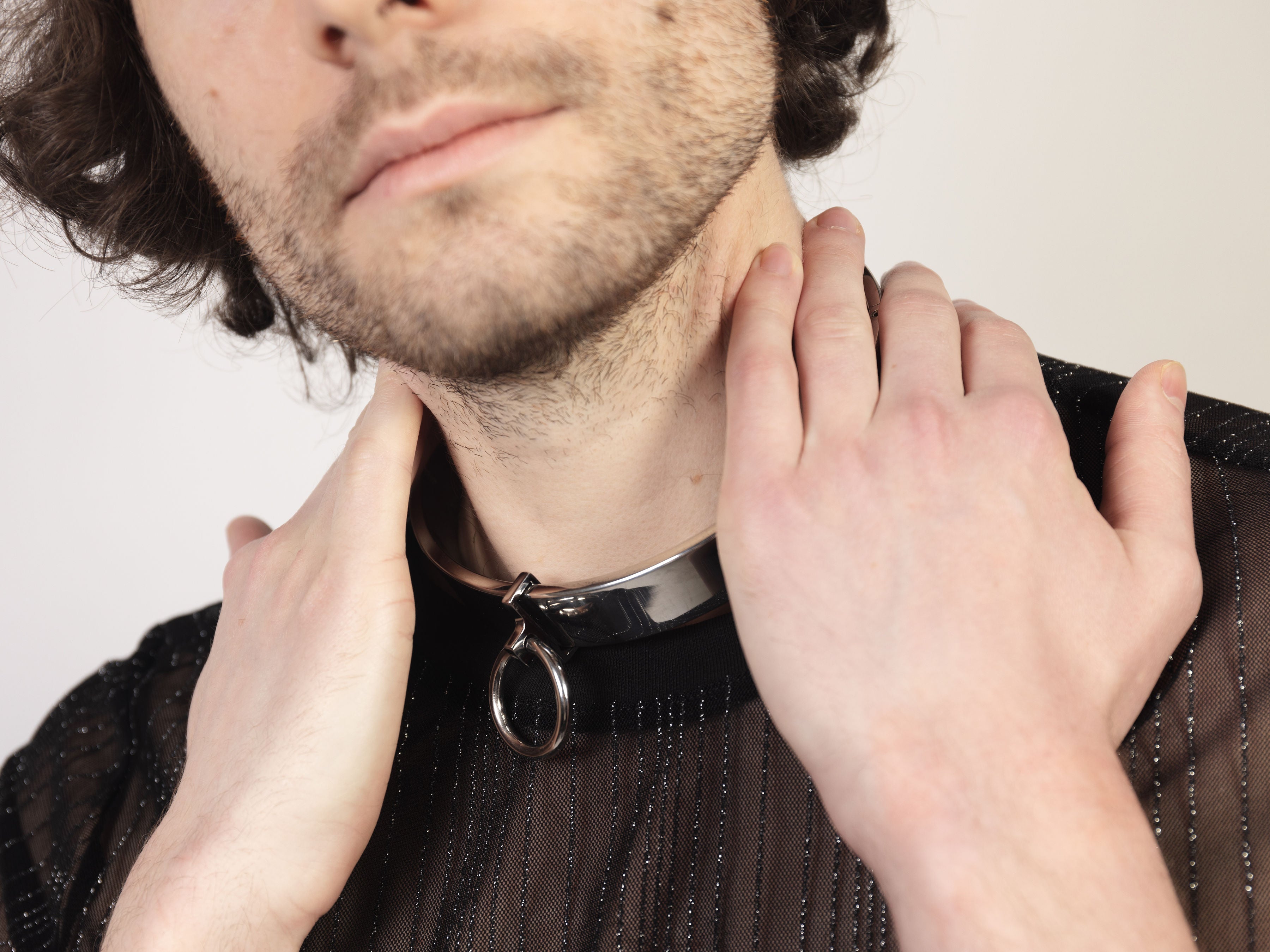 deSade silver flat collar worn on a model's neck, side view