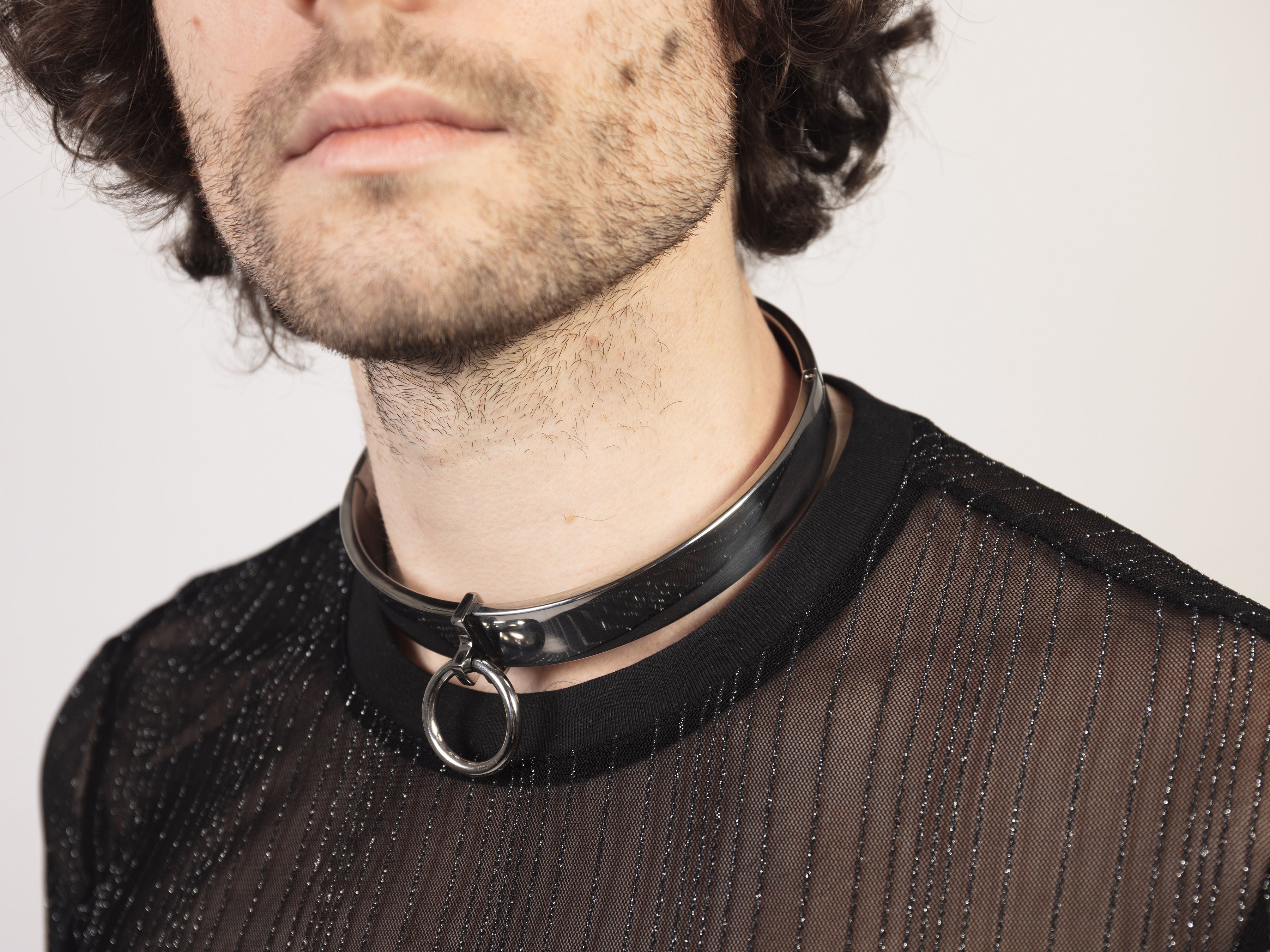deSade silver flat collar worn on a model's neck, back view