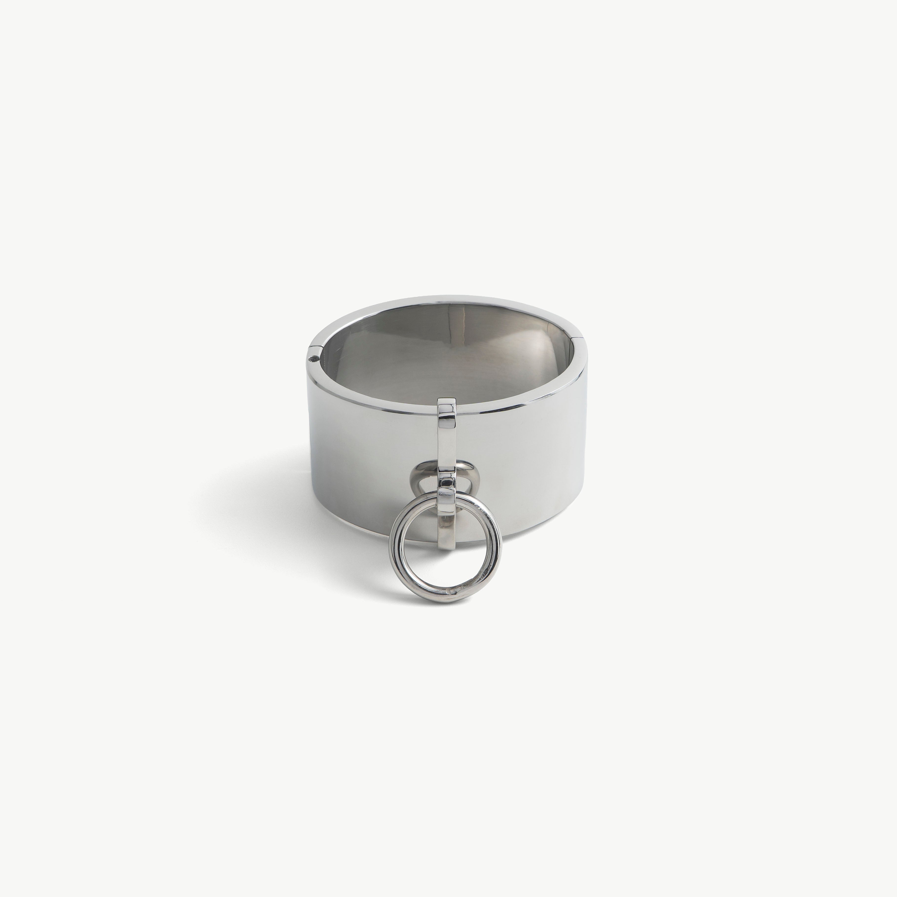 Polished steel deSade wrist band with a hanging O-ring, front view