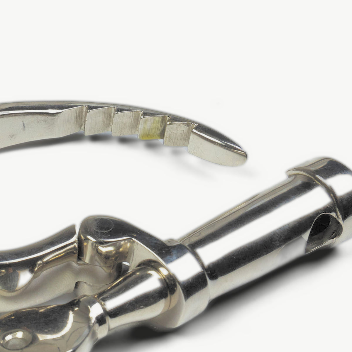 Close-up of the open KUB 121 cuff showing the ratchet arm and lock barrel
