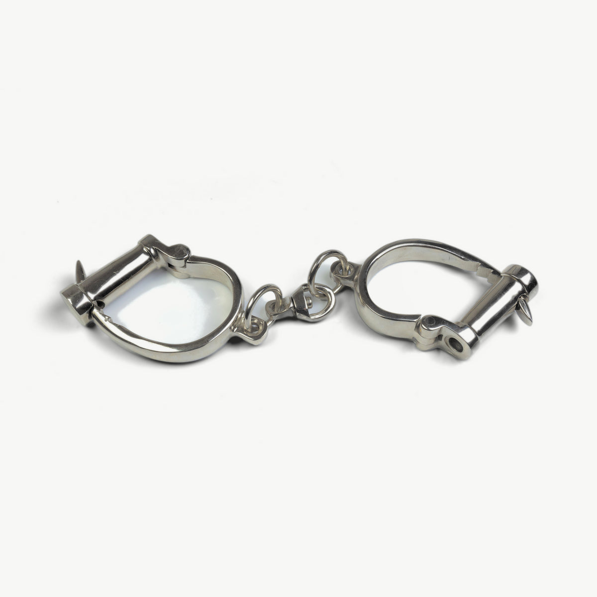 Age of Bondage KUB 121 Darby-style handcuffs in polished steel, front view