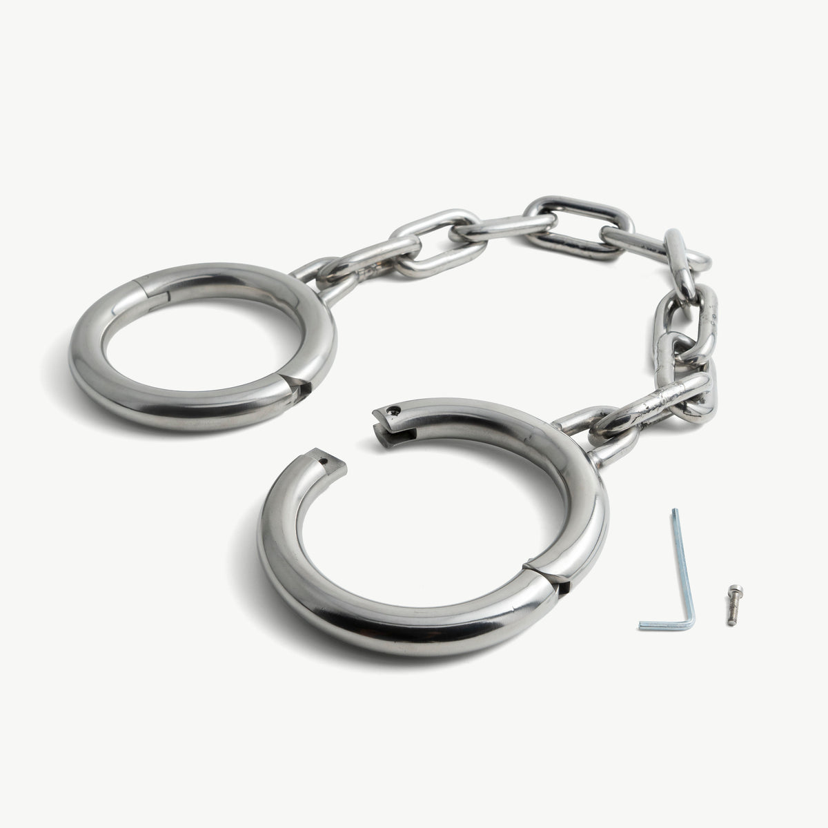 Super heavy stainless steel legcuffs shown open with hex key and lock screw