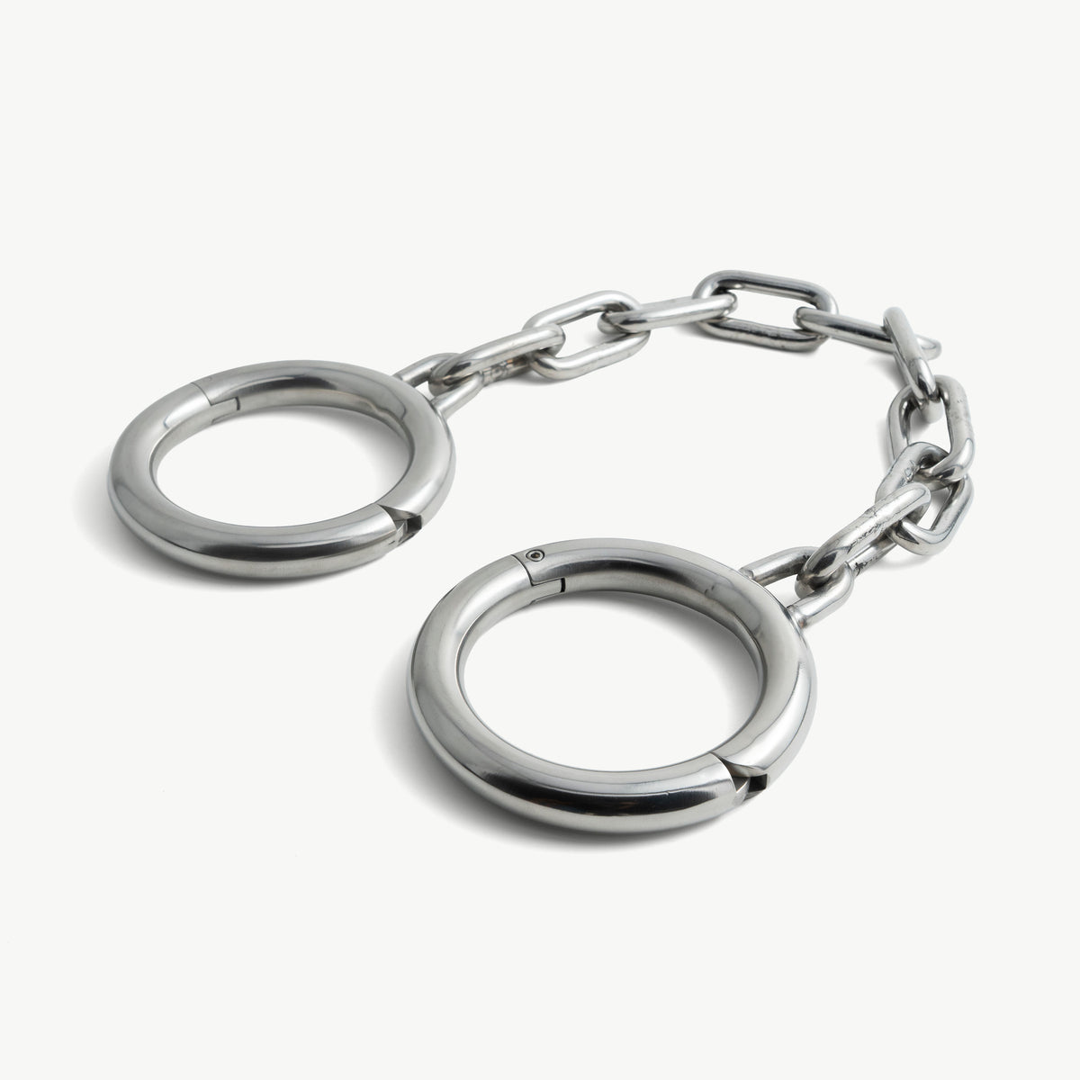 Age of Bondage super heavy stainless steel legcuffs with chain, angled view