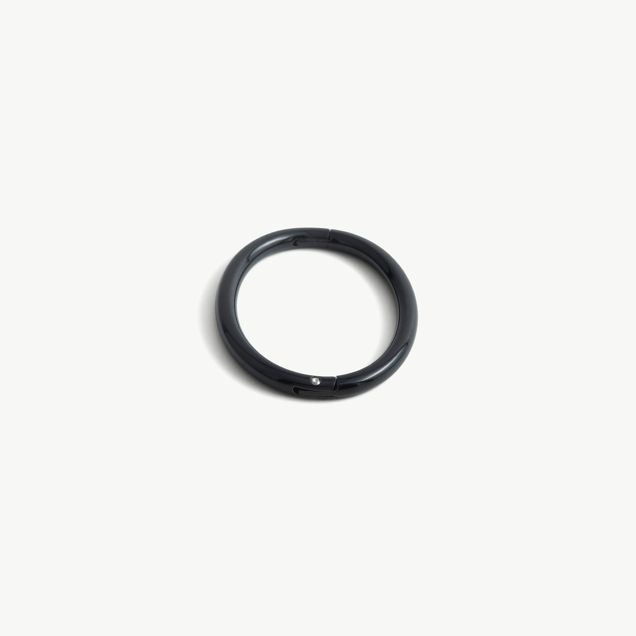 deSade black wrist bracelet seen from the front with the seamless hidden hex lock