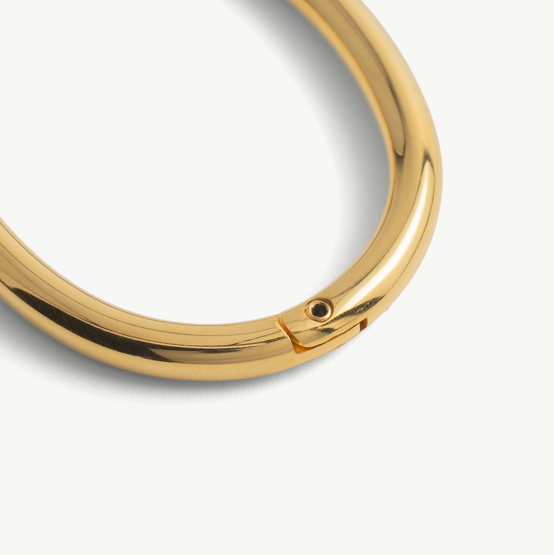 Close-up of the hidden hex lock seam on the gold deSade wrist bracelet