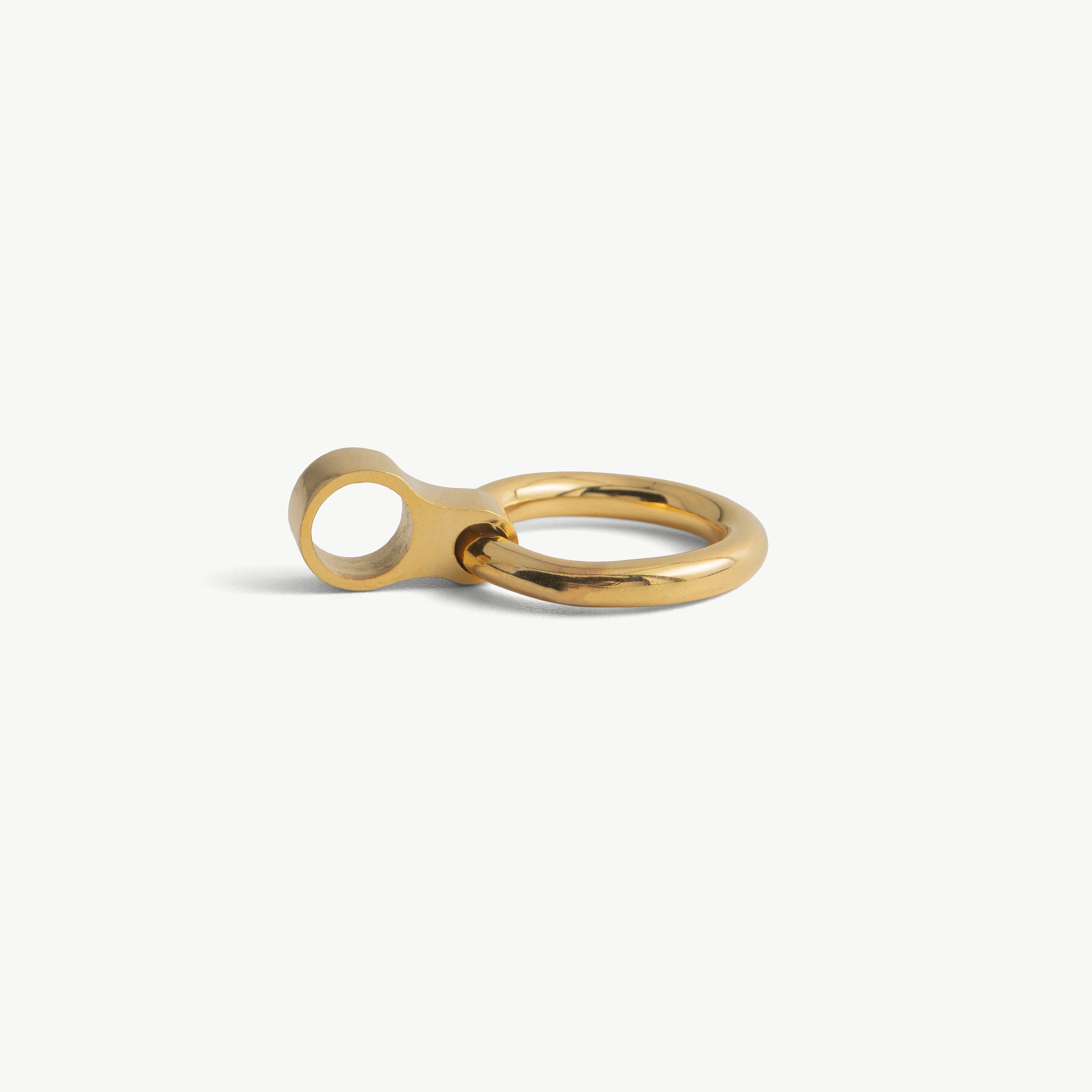 Another close-up of a single gold O-ring pendant and its slide-on loop