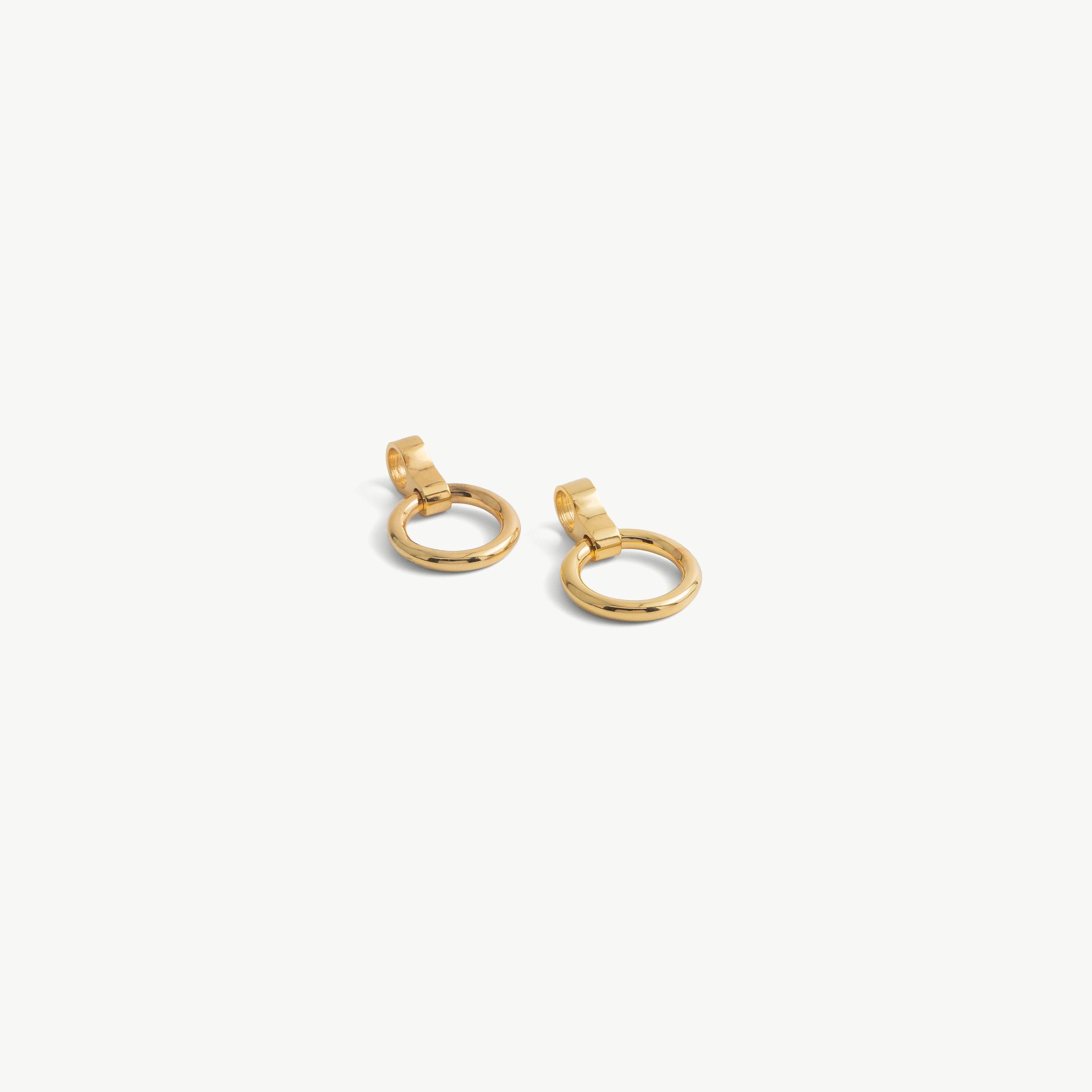Age of Bondage pair of gold O-ring pendants for deSade 8mm jewelry, each with a slide-on loop