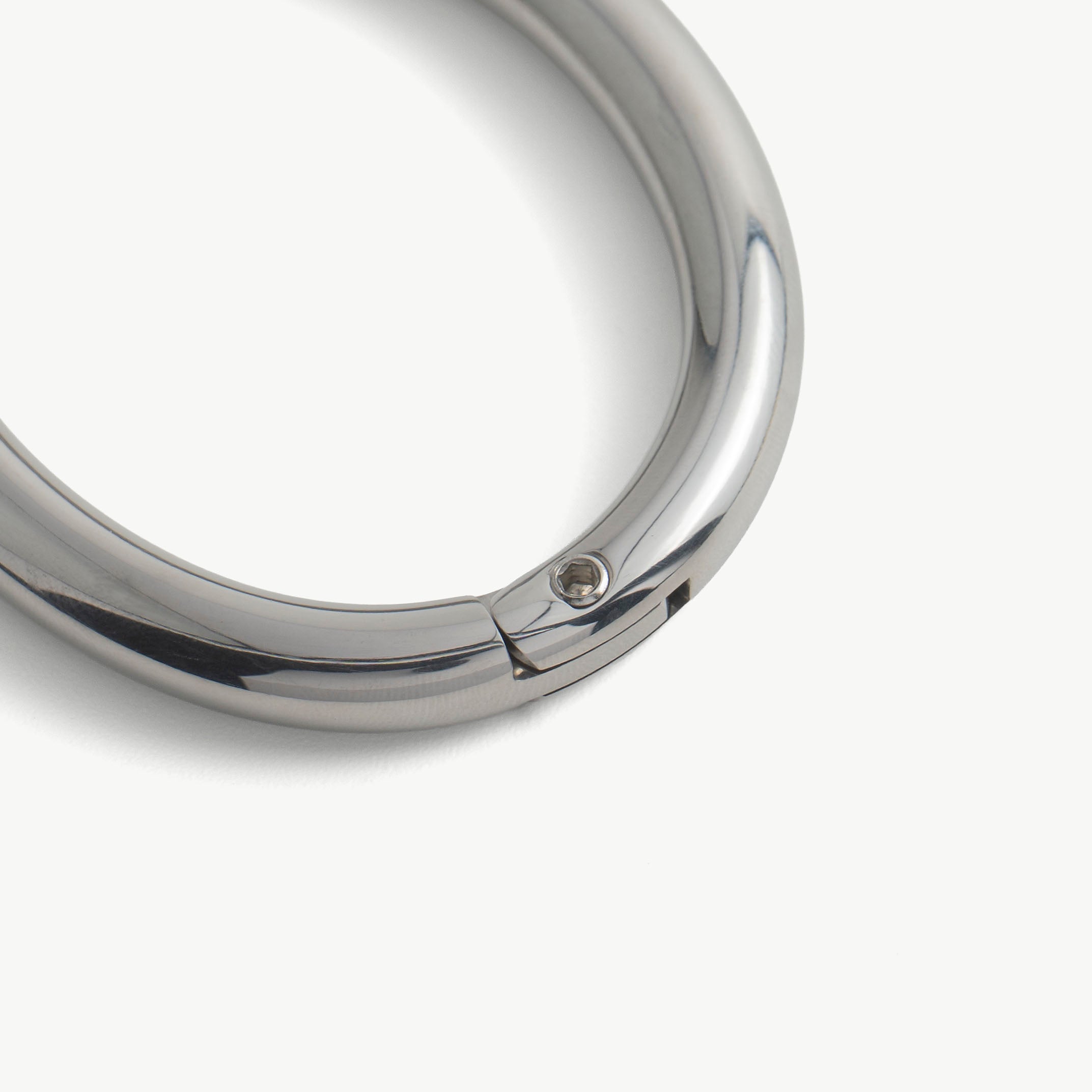Close-up of the hidden hex lock seam on the silver deSade wrist bracelet