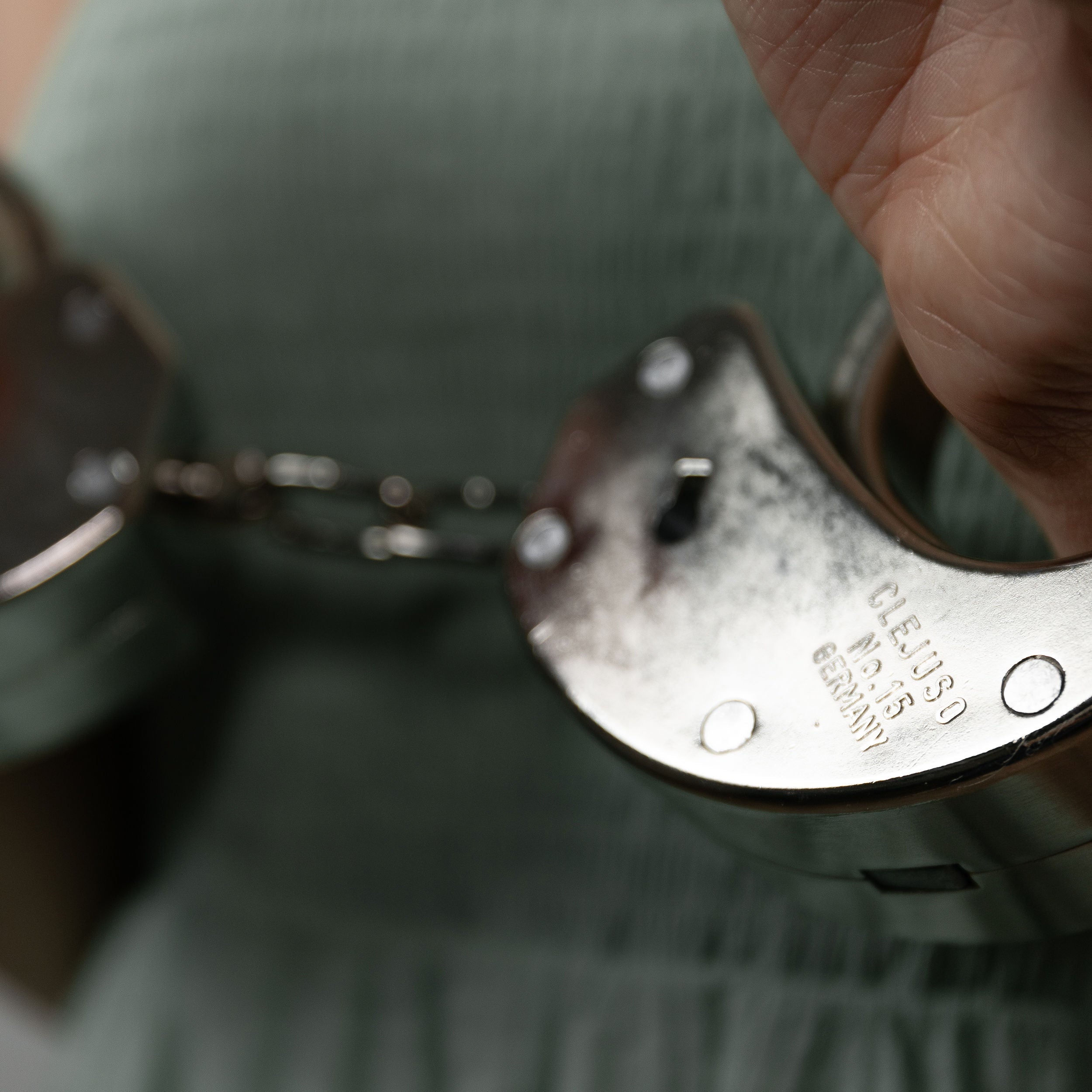 Clejuso No. 15 handcuffs shown in use
