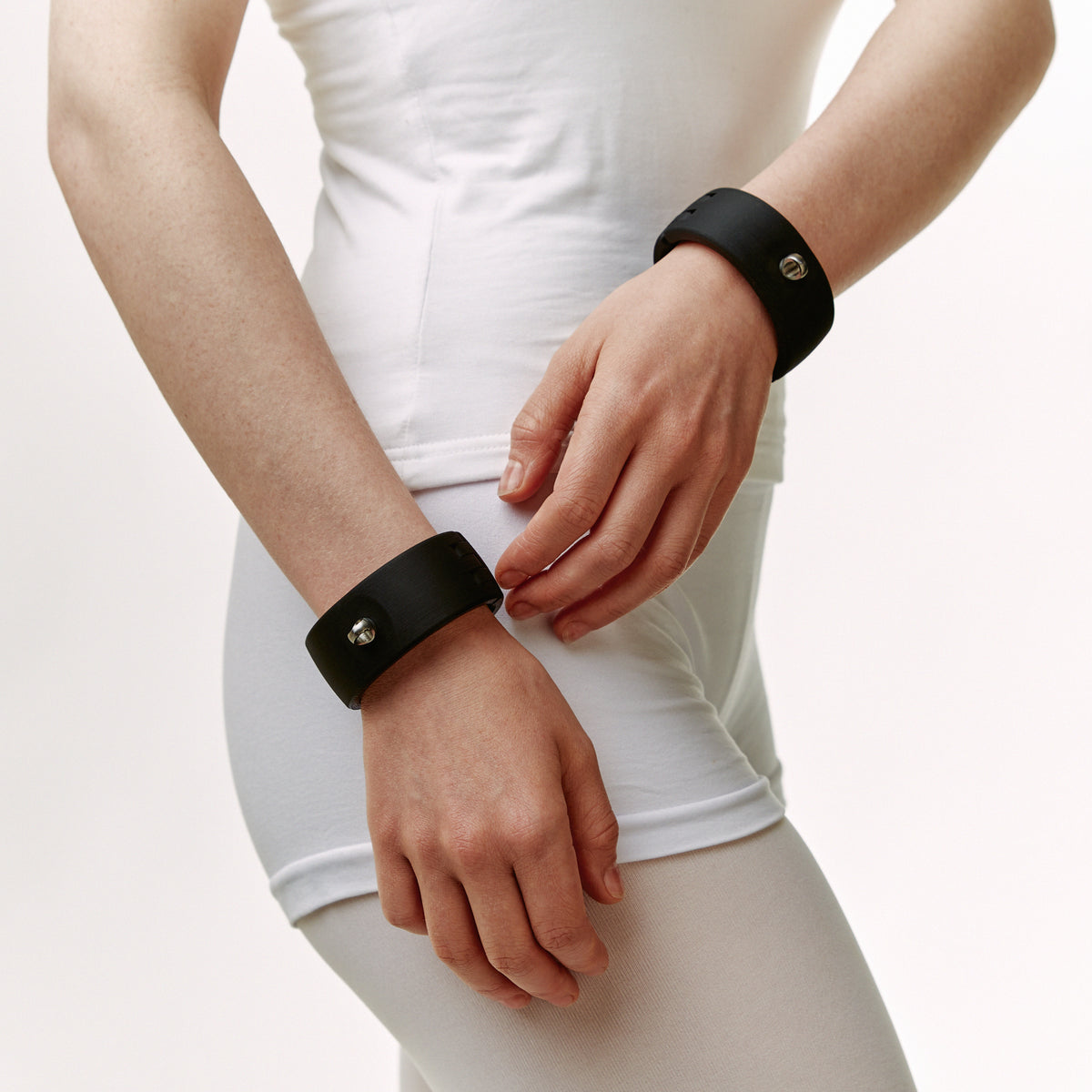 Black Quick Cuffs Adapt worn singly on both wrists, hands free and lowered