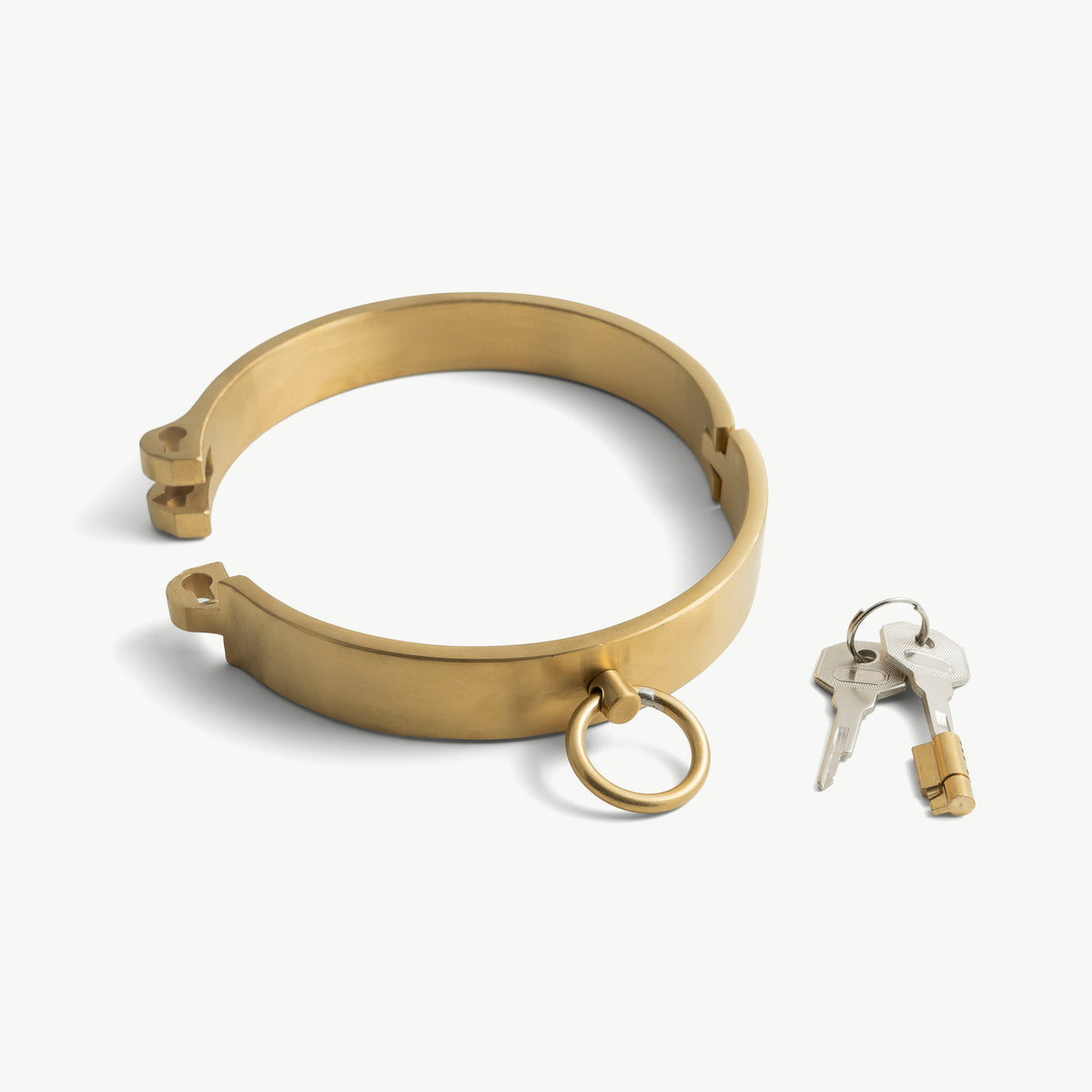 Gold flat collar shown open with its push-in lock and two keys