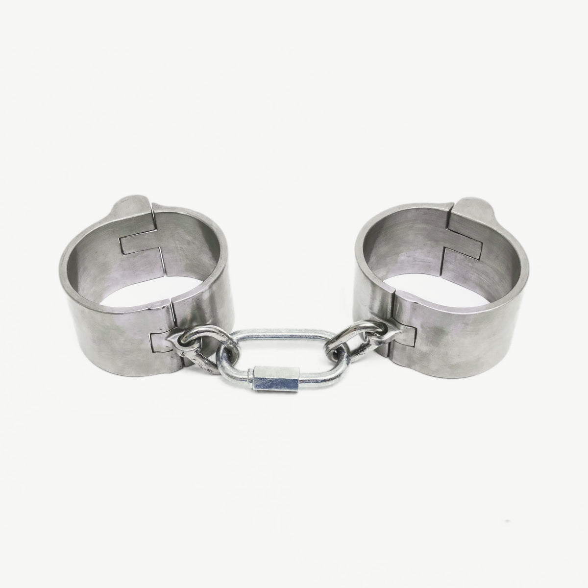 Age of Bondage massive 40mm push-in handcuffs in brushed steel with short chain, front view
