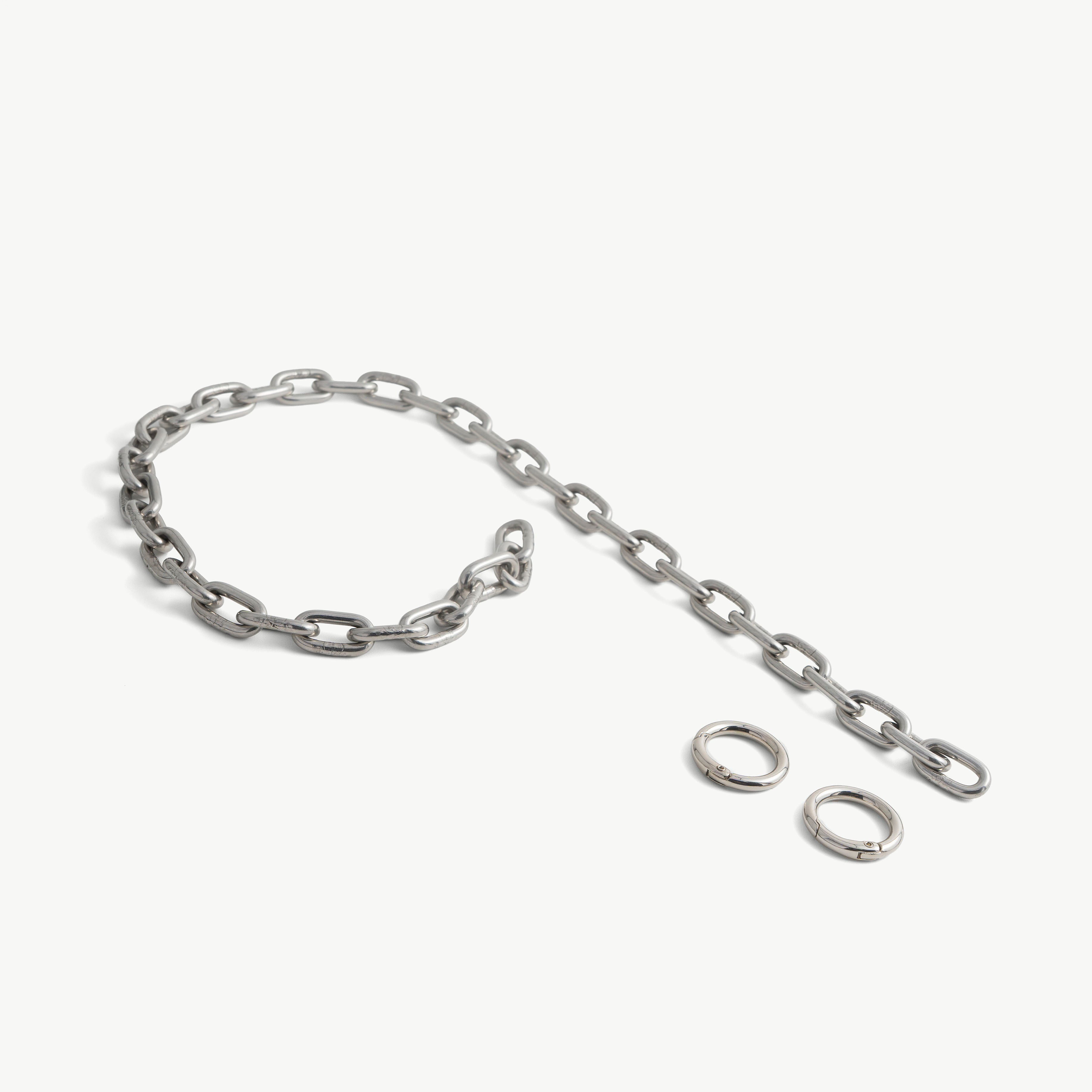 Stainless steel choker chain laid out with its two spring-gate O-ring clasps
