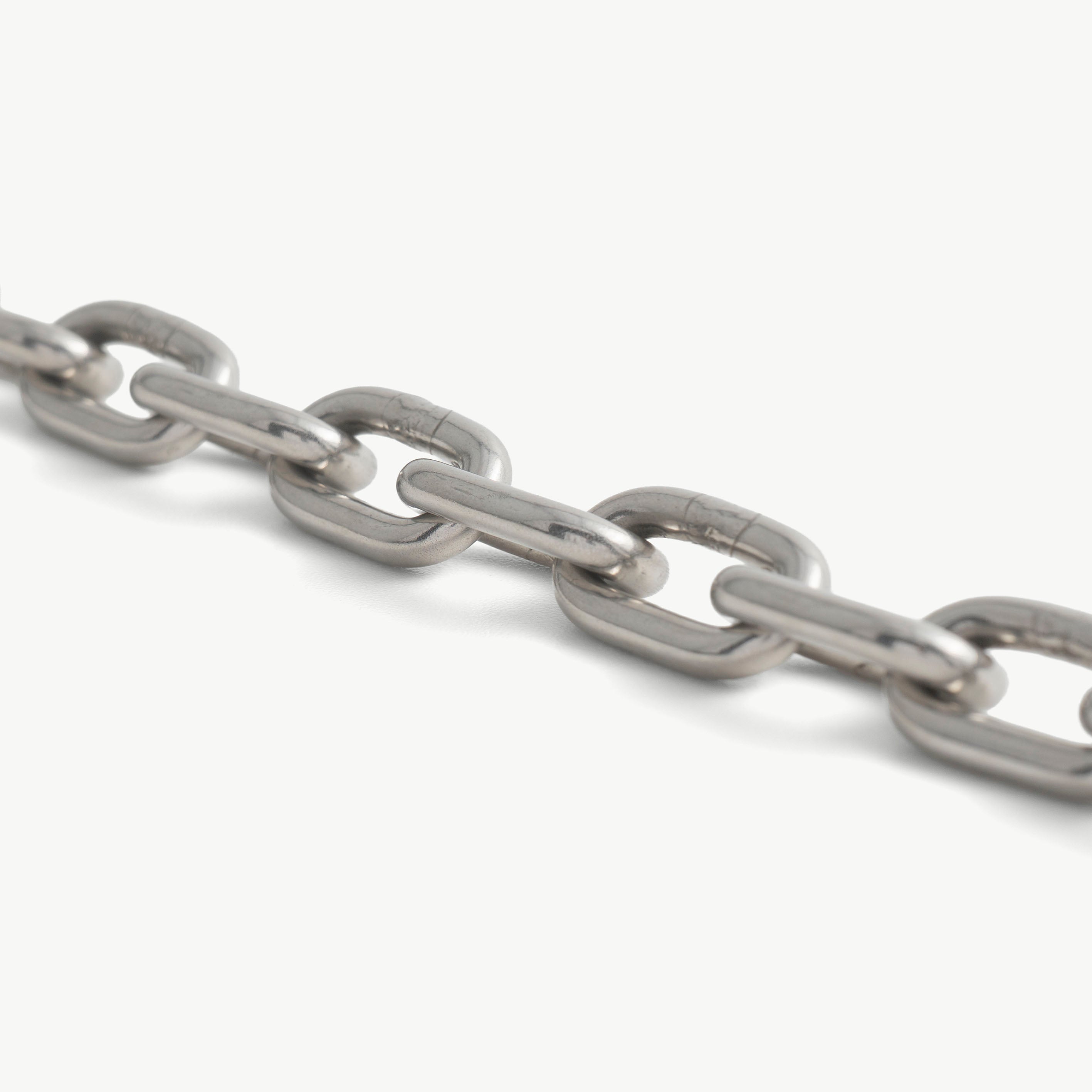 Close-up of the chunky polished stainless steel choker chain links