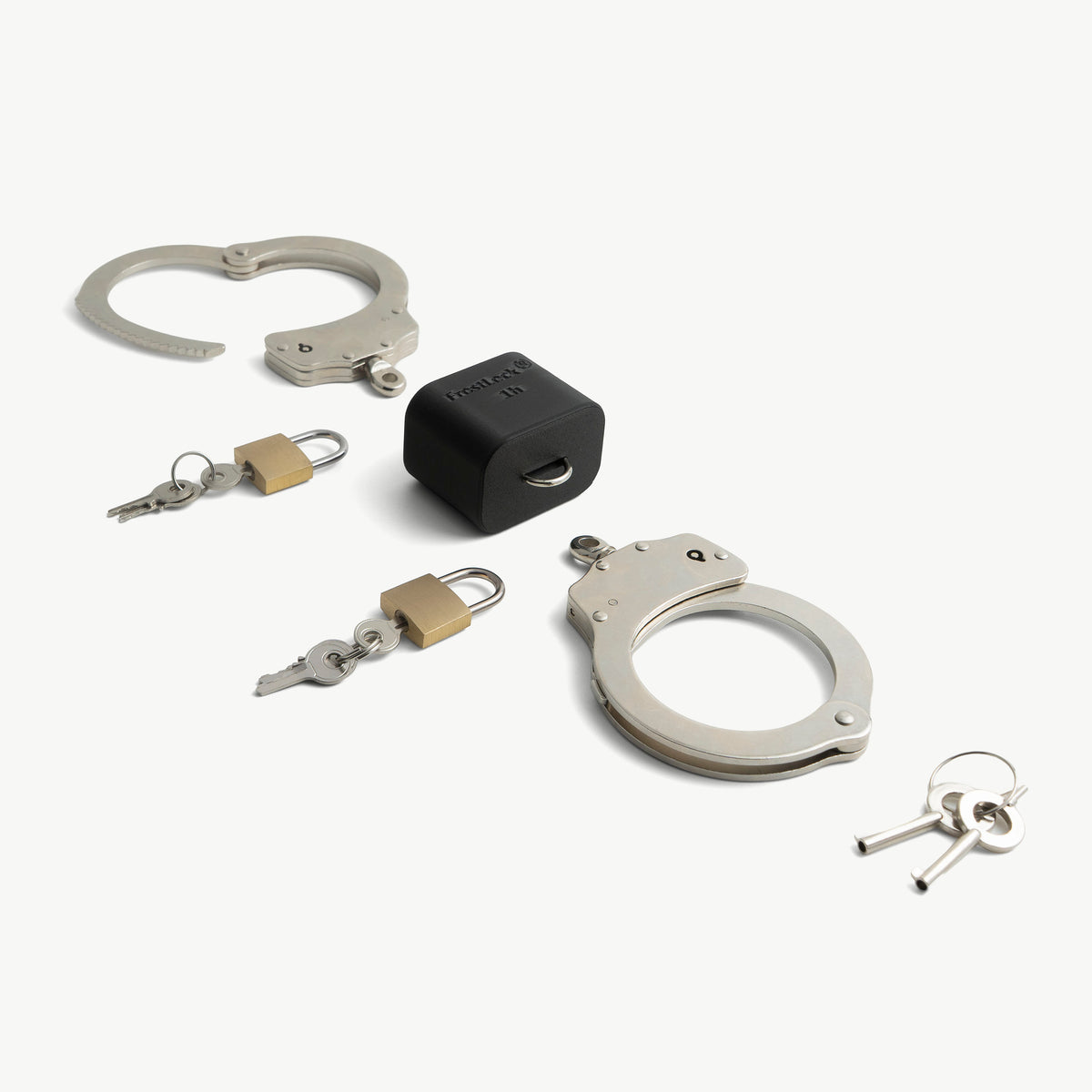 Self-Bondage Starter Set shown with all parts: handcuffs, FrostLock ice lock, padlocks and keys