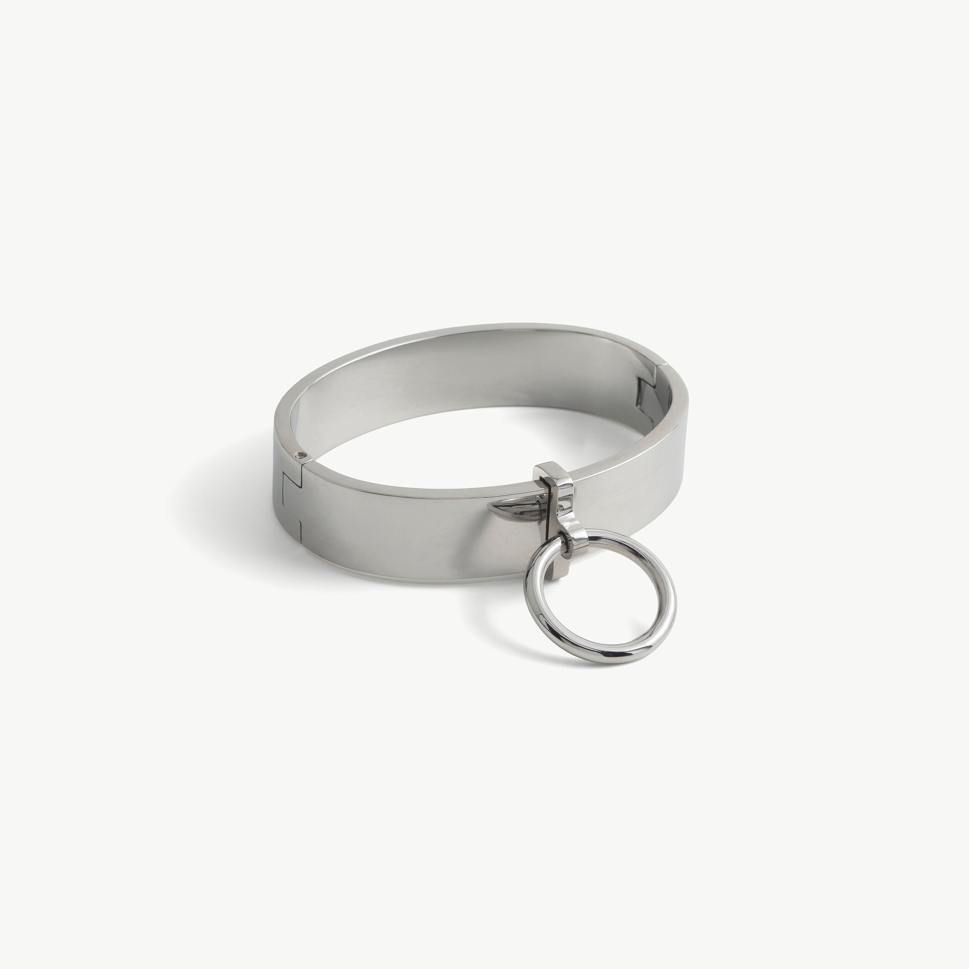 Age of Bondage deSade ankle band in polished steel, 20mm locking cuff with hanging O-ring