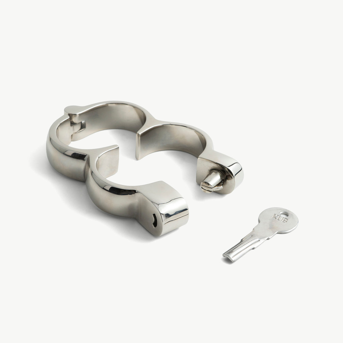 Irish 8 handcuffs shown open in two halves beside their key