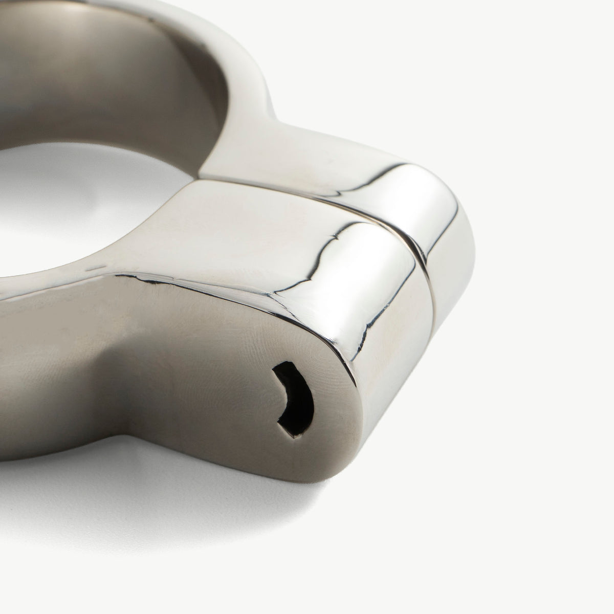 Close-up of the Irish 8 handcuffs' polished locking end and keyhole