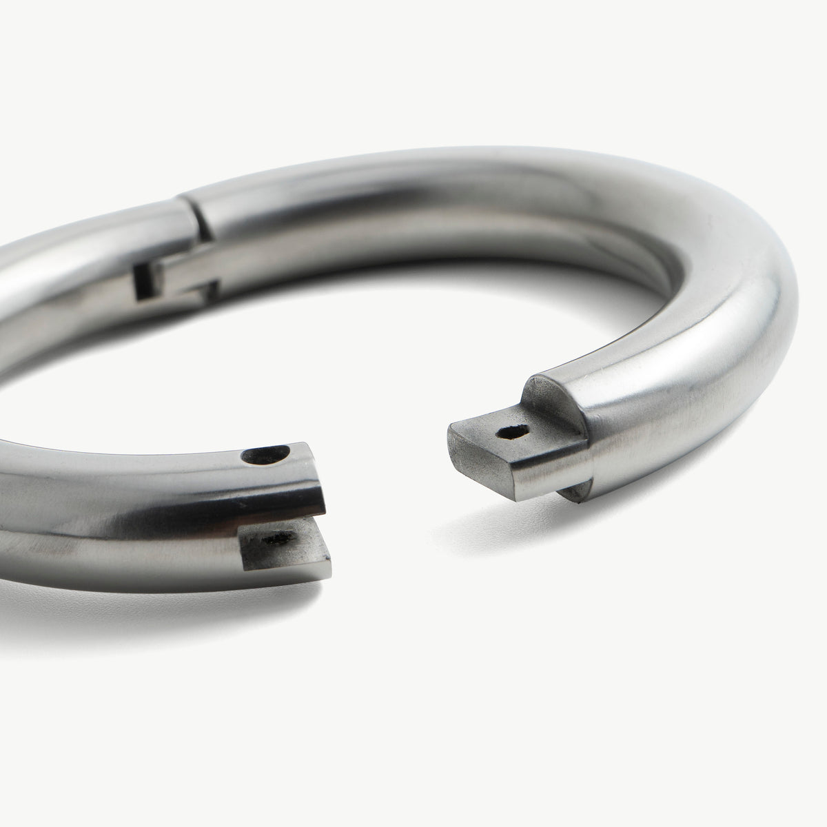 Close-up of the open super heavy legcuff ends and lock screw hole