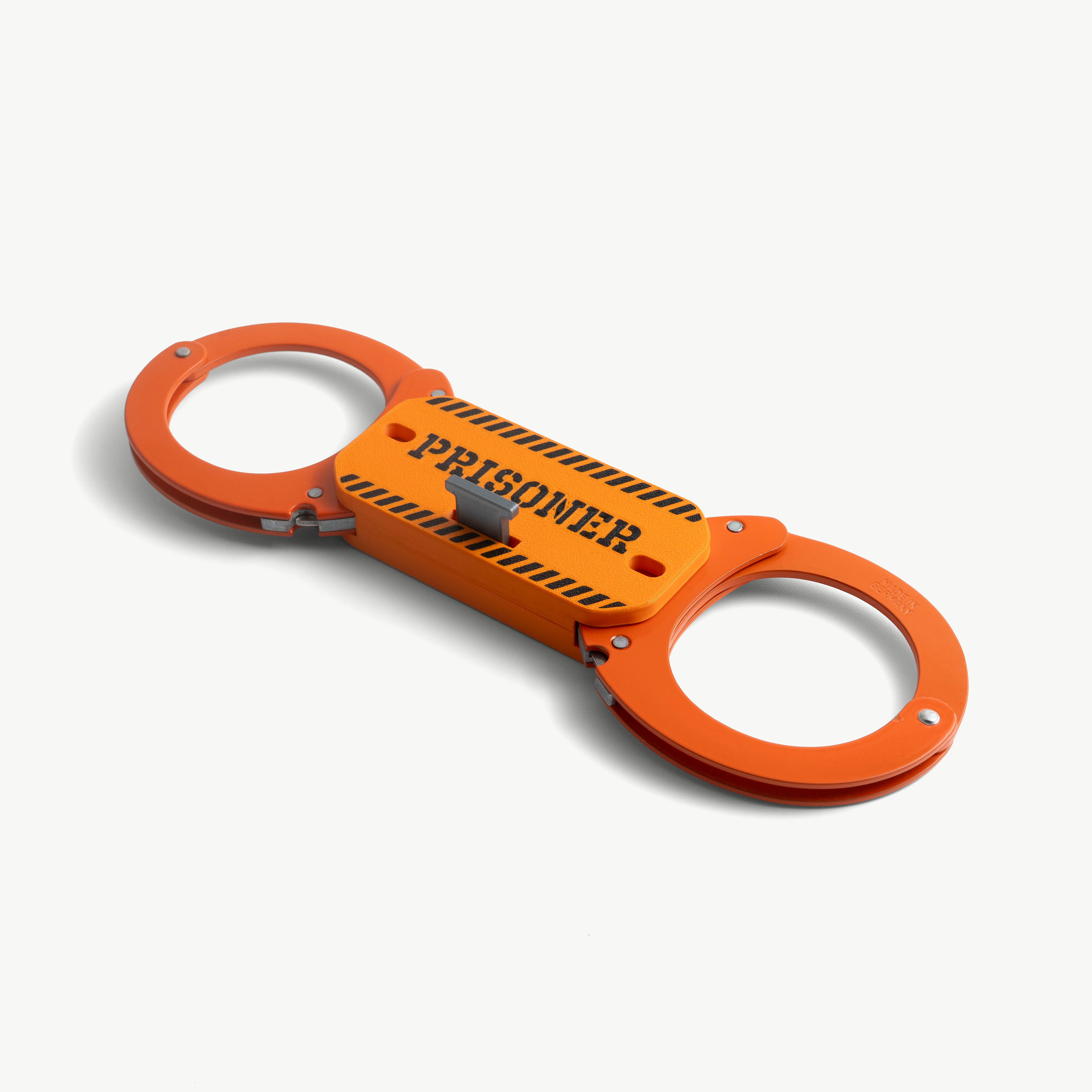 Make-It-Rigid PRISONER stiffener mounted on orange Clejuso Mod. 12A handcuffs