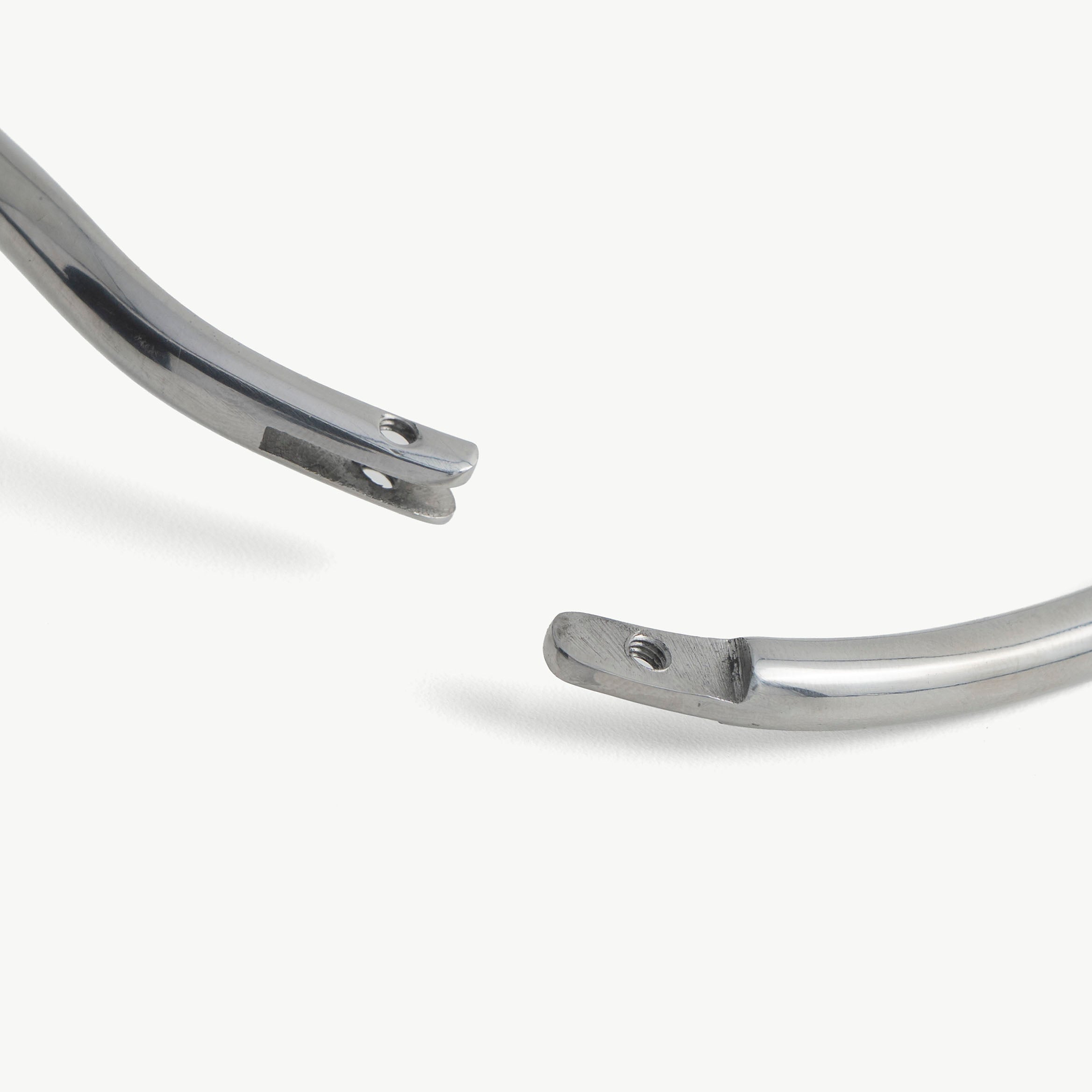 Close-up of the deSade collar's hex lock opening at the polished ends