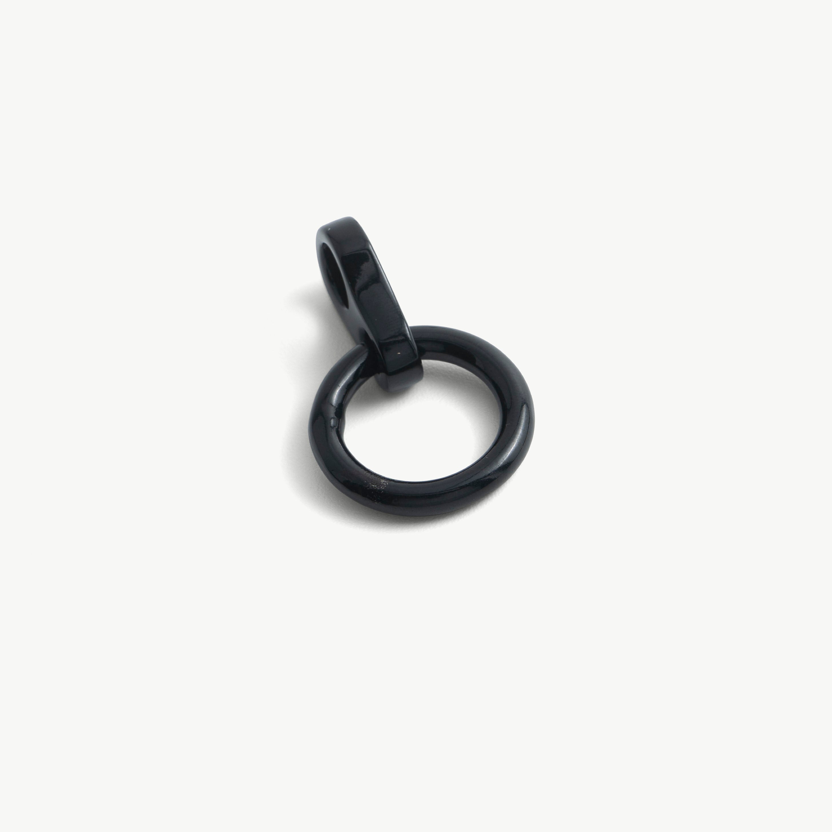Close-up of a single black O-ring pendant with its cylindrical slide-on loop