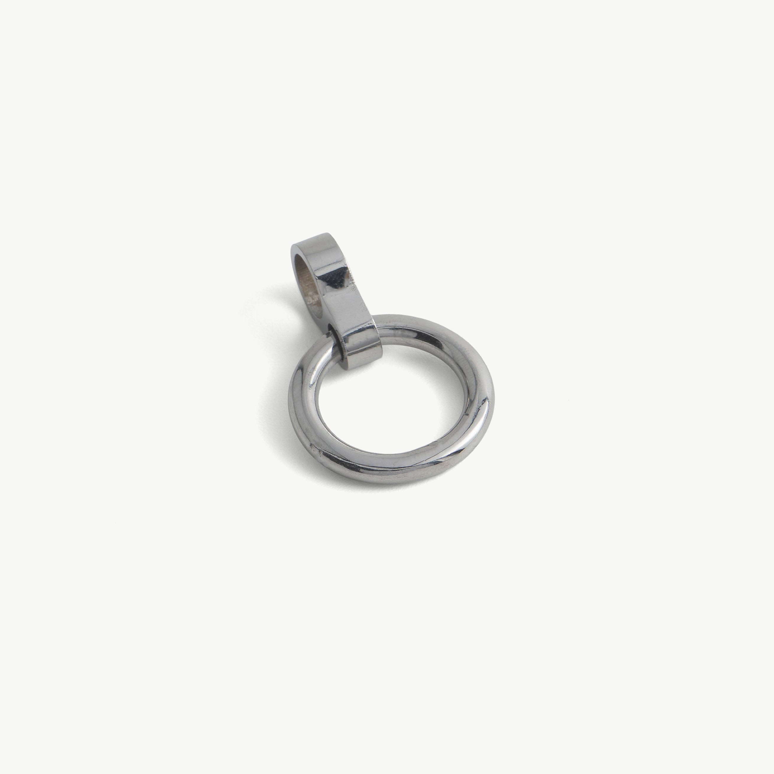 Close-up of a single silver O-ring pendant with its cylindrical slide-on loop