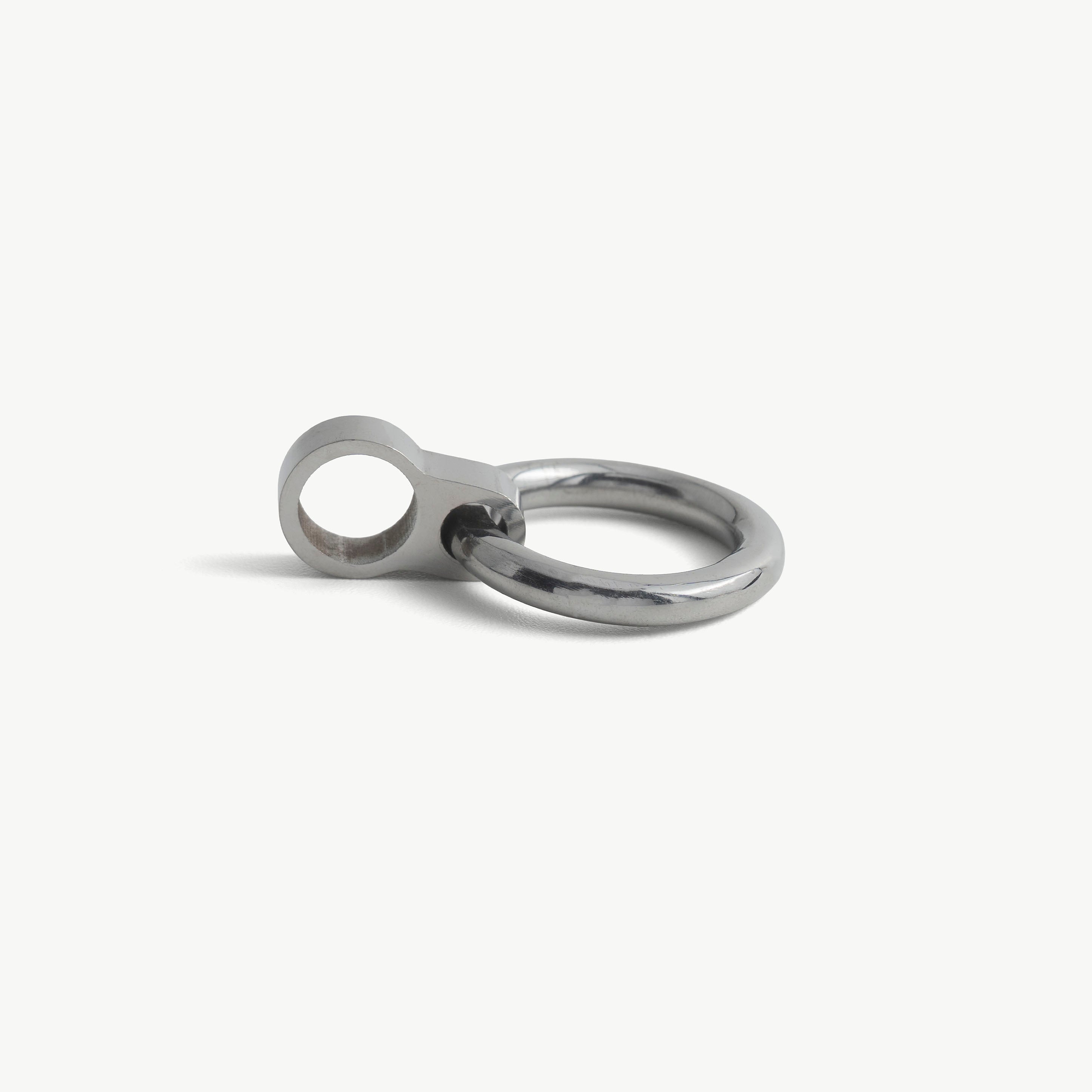 Another close-up of a single silver O-ring pendant and its slide-on loop