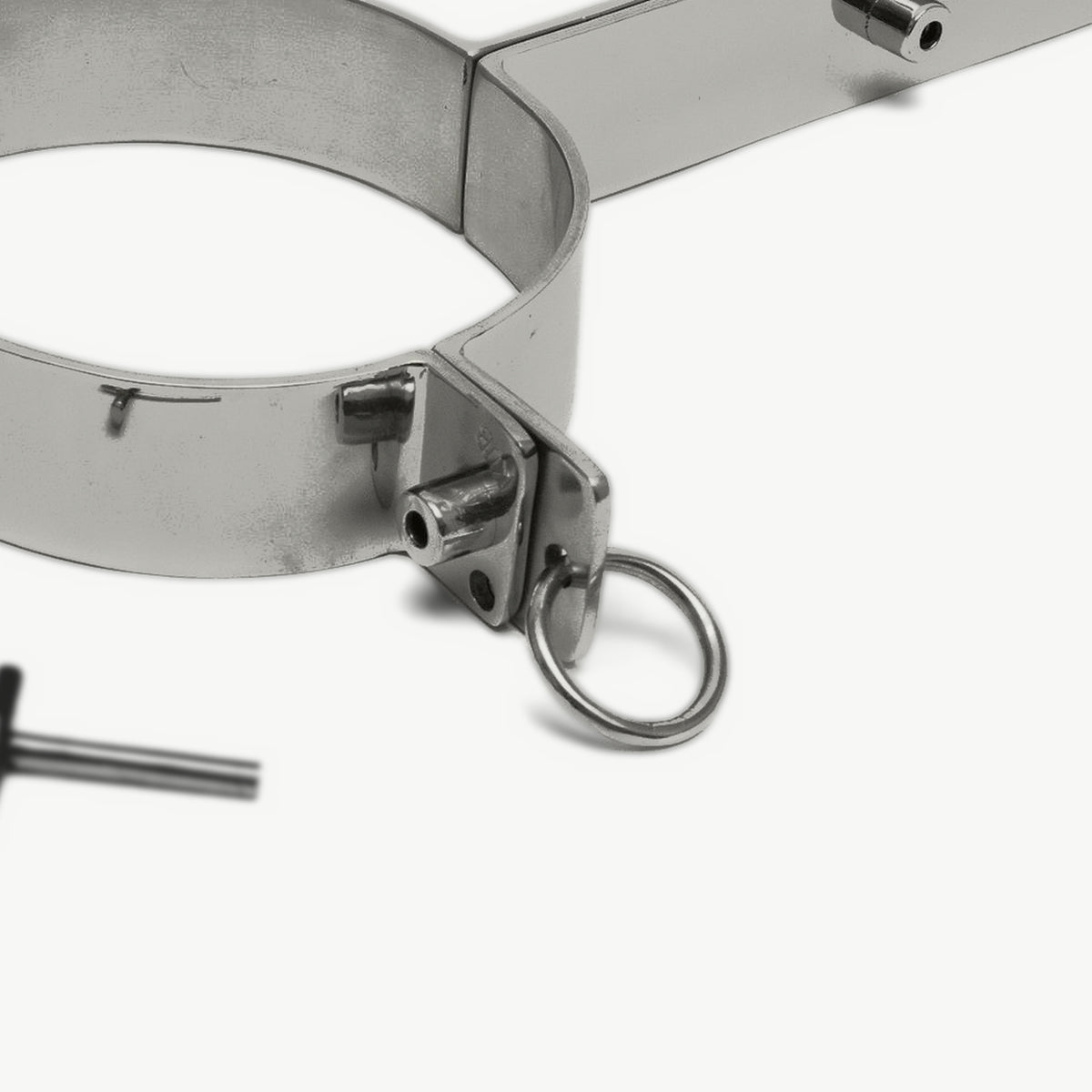 Close-up of the pillory's neck ring lock with the locking pin