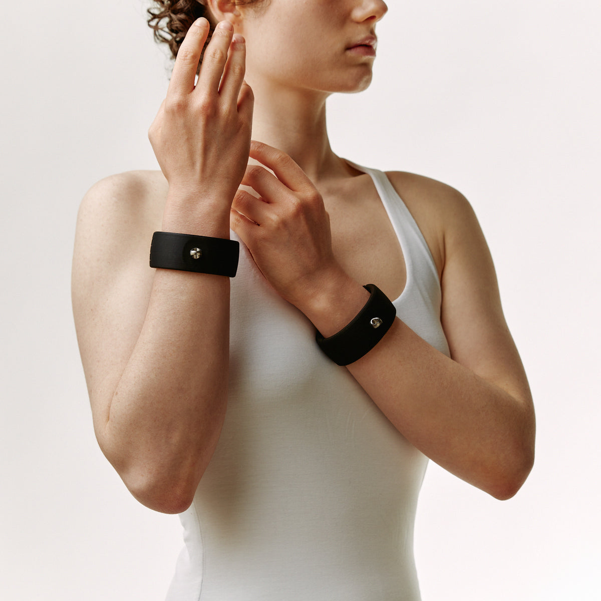 Black Quick Cuffs Adapt worn singly on both wrists, hands free and raised