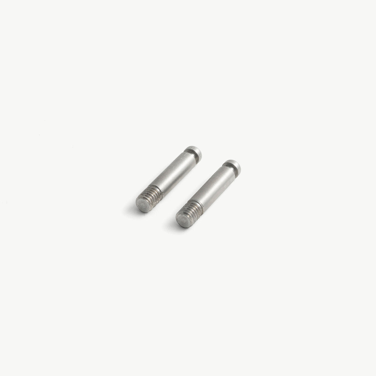 Two stainless steel medical lock pins with M6 thread, diagonal view