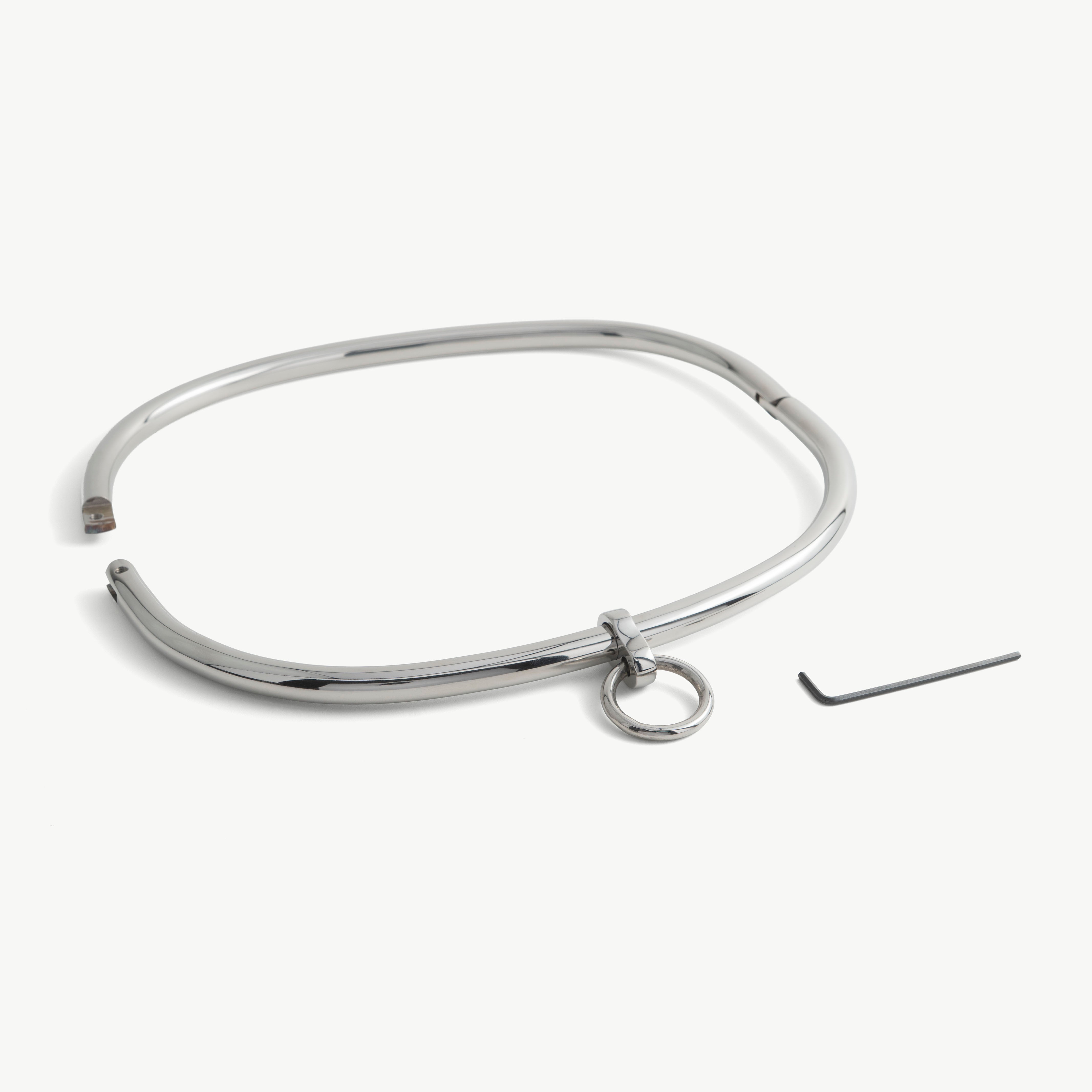 Steel waist restraint belt shown open beside its key