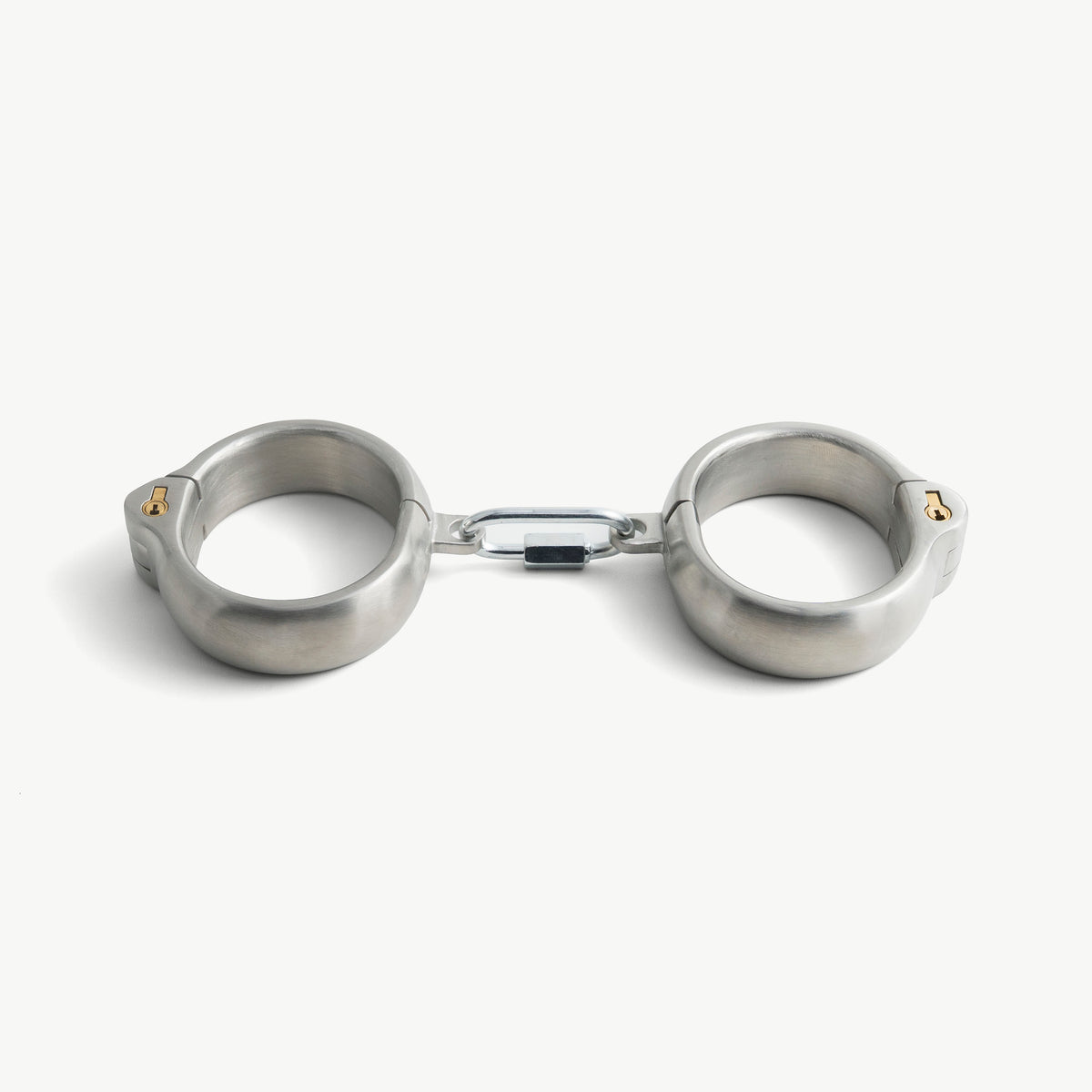 Age of Bondage rounded handcuffs in brushed stainless steel with push-in lock, front view