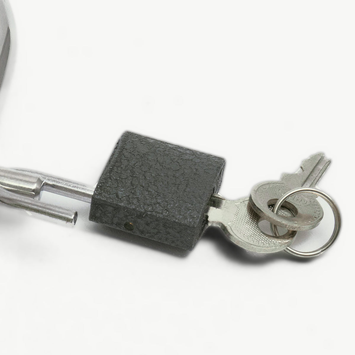 Close-up of the padlock and keys on the foldable handcuffs